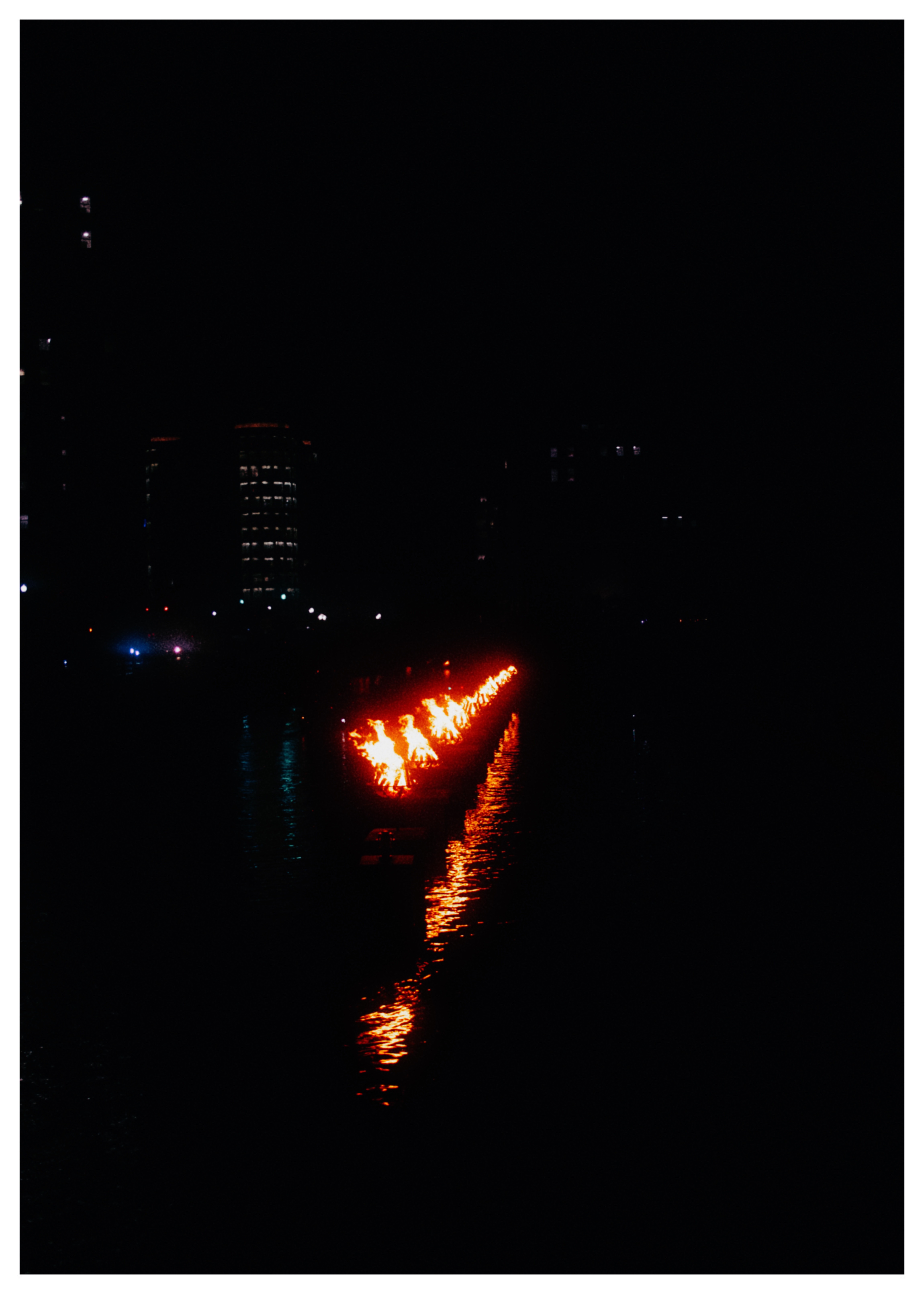WaterFire on the river at night