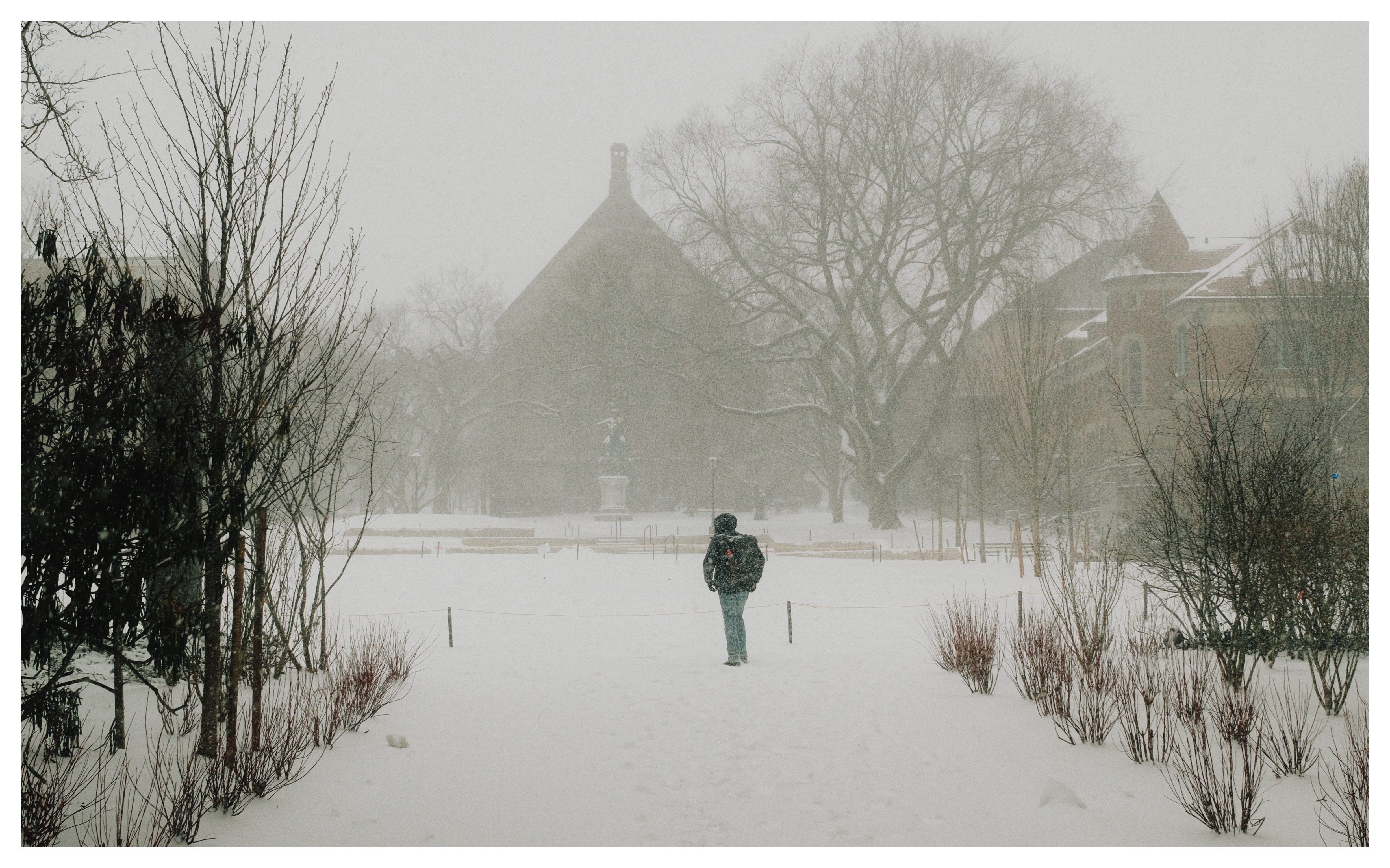 Crossing the green in a snowstorm